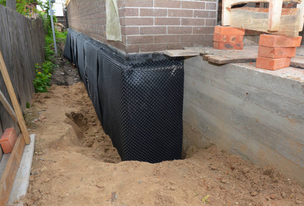 Happy homeowners after waterproofing job in West Milton